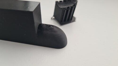 The same structure as before with the support removed. the structure is also upside down. You can see some irregular printed lines on the place where the support structure is removed.